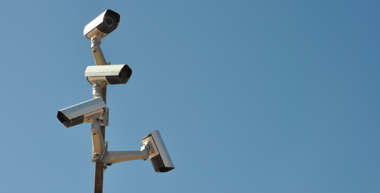 Multiple traffic cameras installed on a pole.